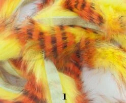 Hareline Tiger Barred Rabbit Zonker Strips - Funky Fly Tying 25 Hareline Tiger Barred Rabbit Zonker Strips - Funky Fly Tying -Fishing Accessories Store Hareline Magnum Cut Tiger Barred Zonkers Black Orange Over Yellow 3